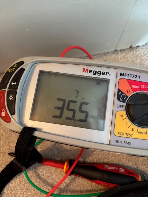 Megger MFT1721 multifunction tester showing a live test reading during an electrical inspection
