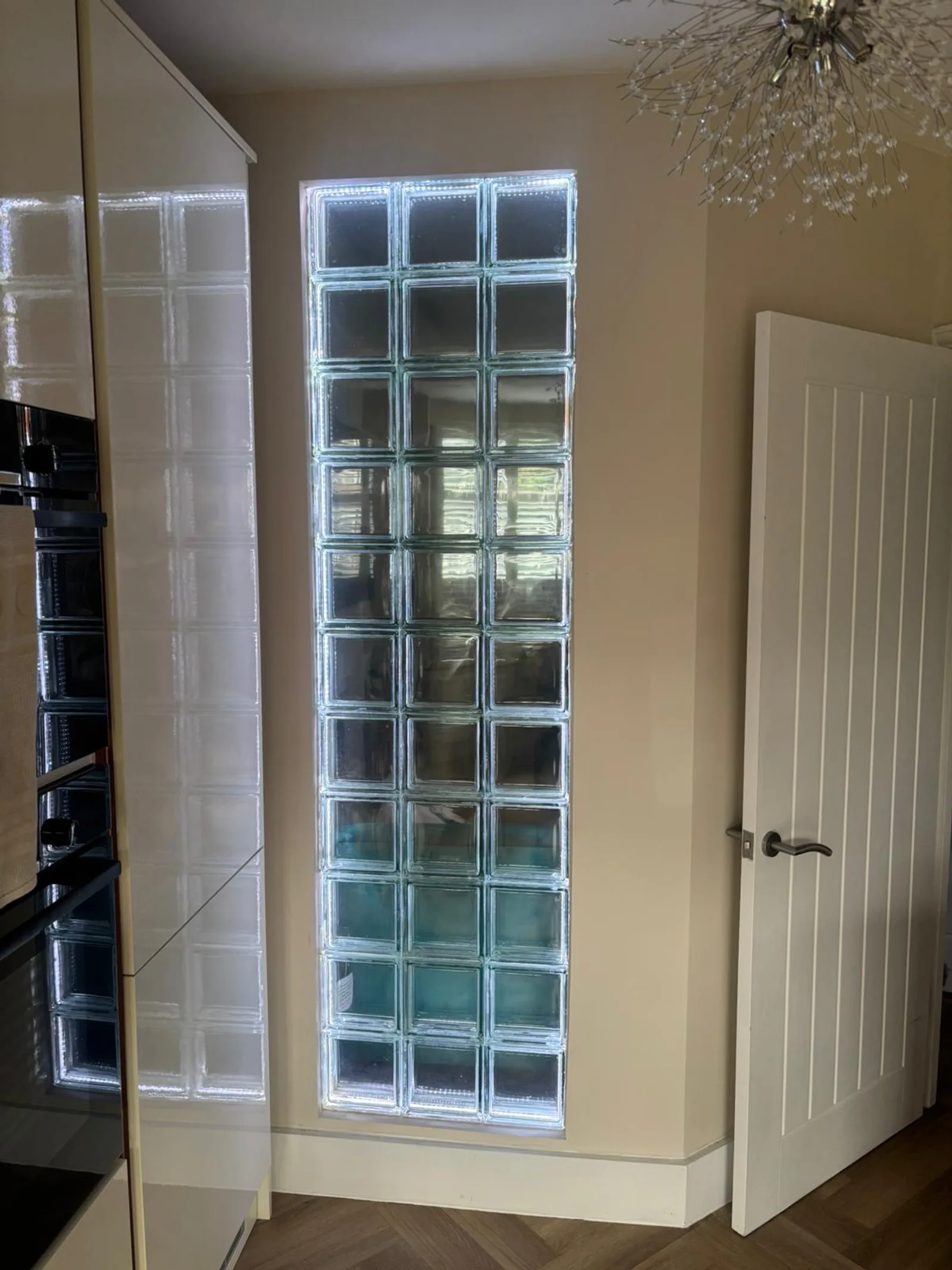 The same Sidcup Electrical glass block feature wall lit in crisp cool white